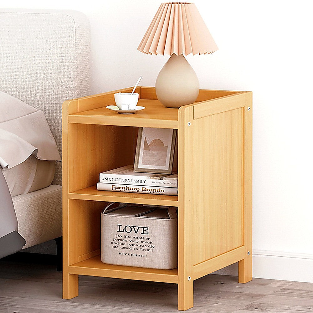 Ocean Shores natural compact bamboo bedside table with drawer and shelf in a bedroom