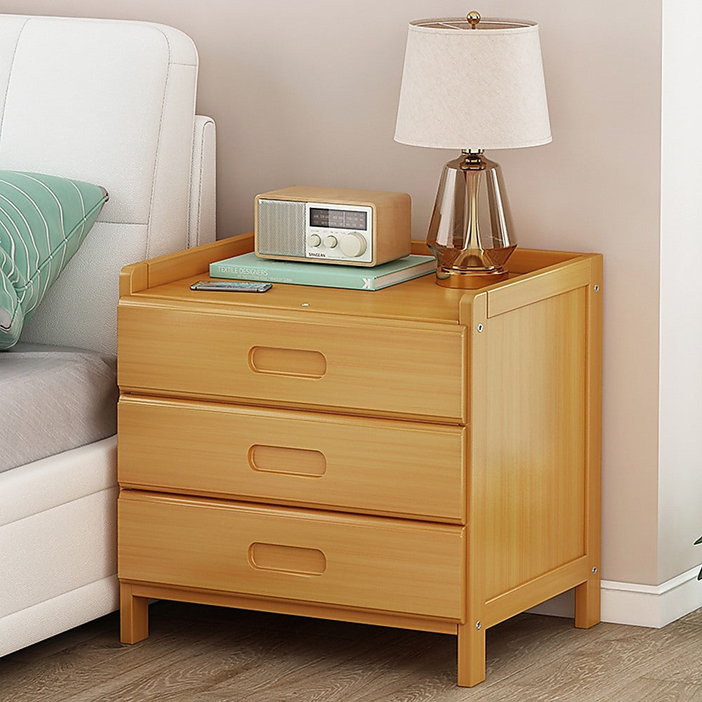 Bangalow natural bamboo three drawer bedside table styled in a calm coastal bedroom