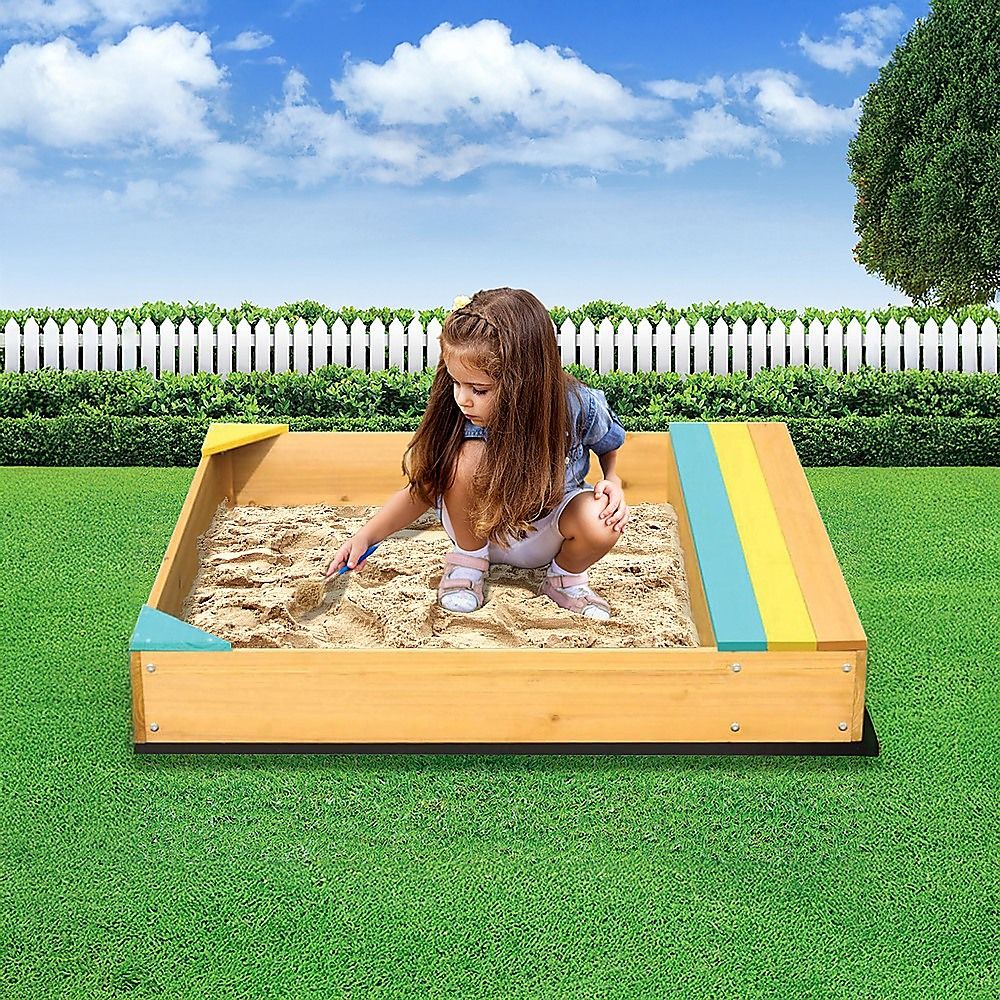 Wooden sandpit with bench seat and storage in blue and yellow