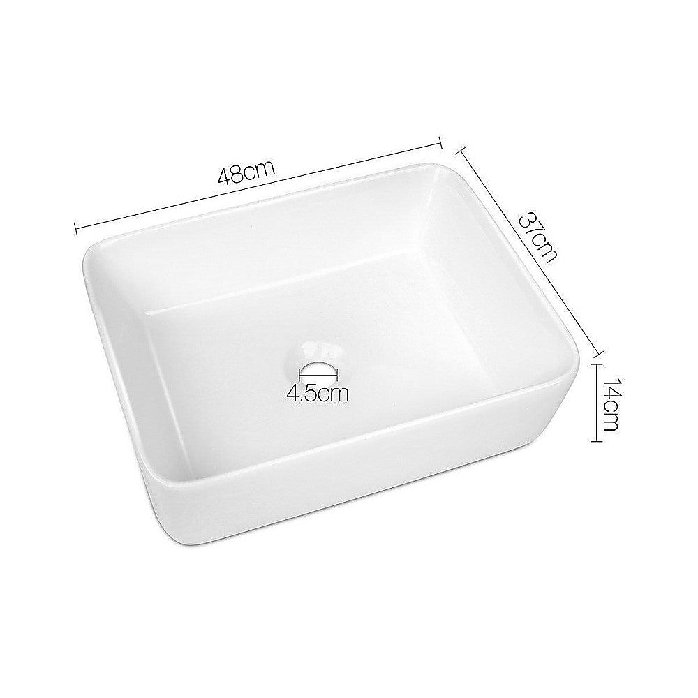 White square ceramic above counter basin, drain hole detail