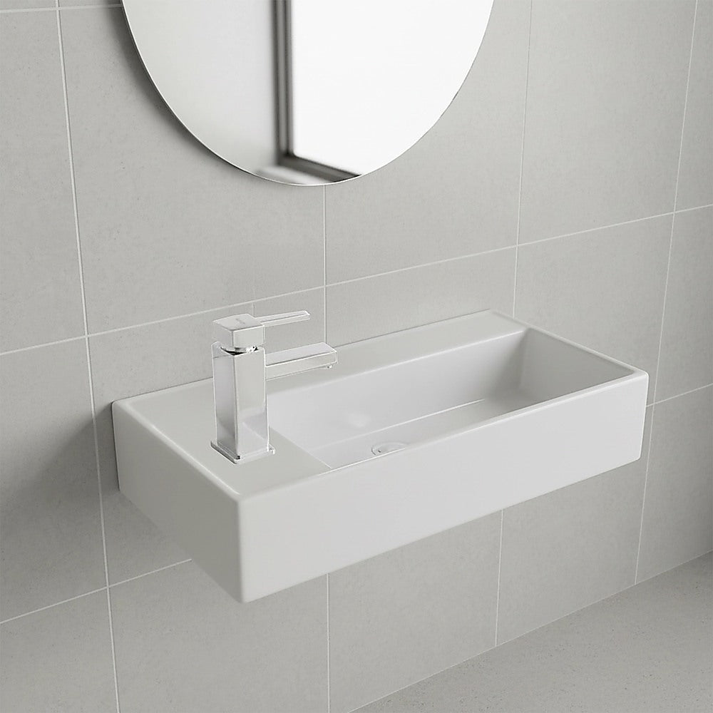 White ceramic compact hand wash basin, angled view