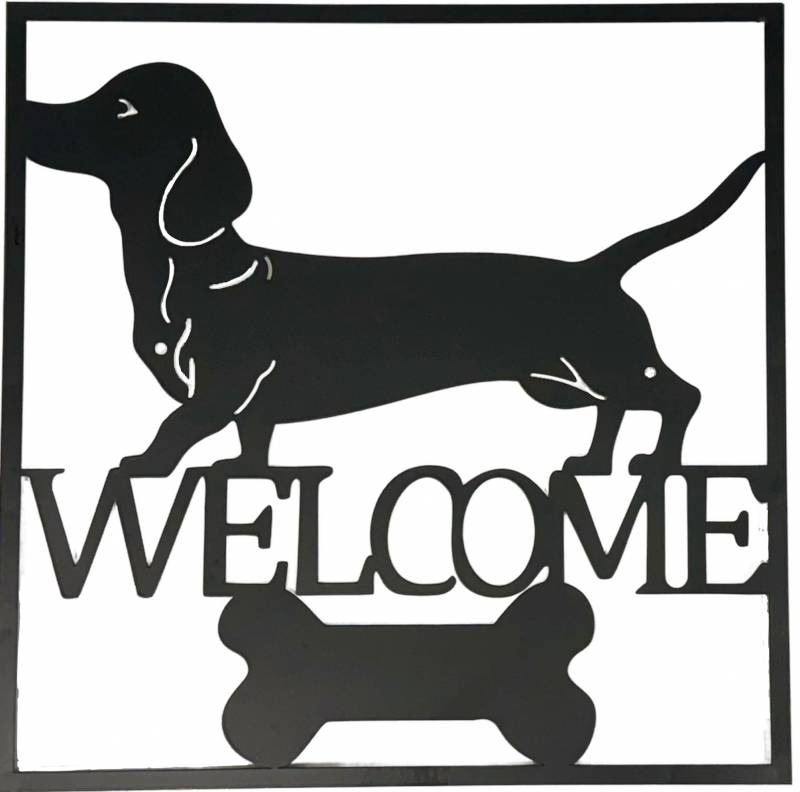 Black metal dachshund welcome wall art 40 cm hanging on a light wall
