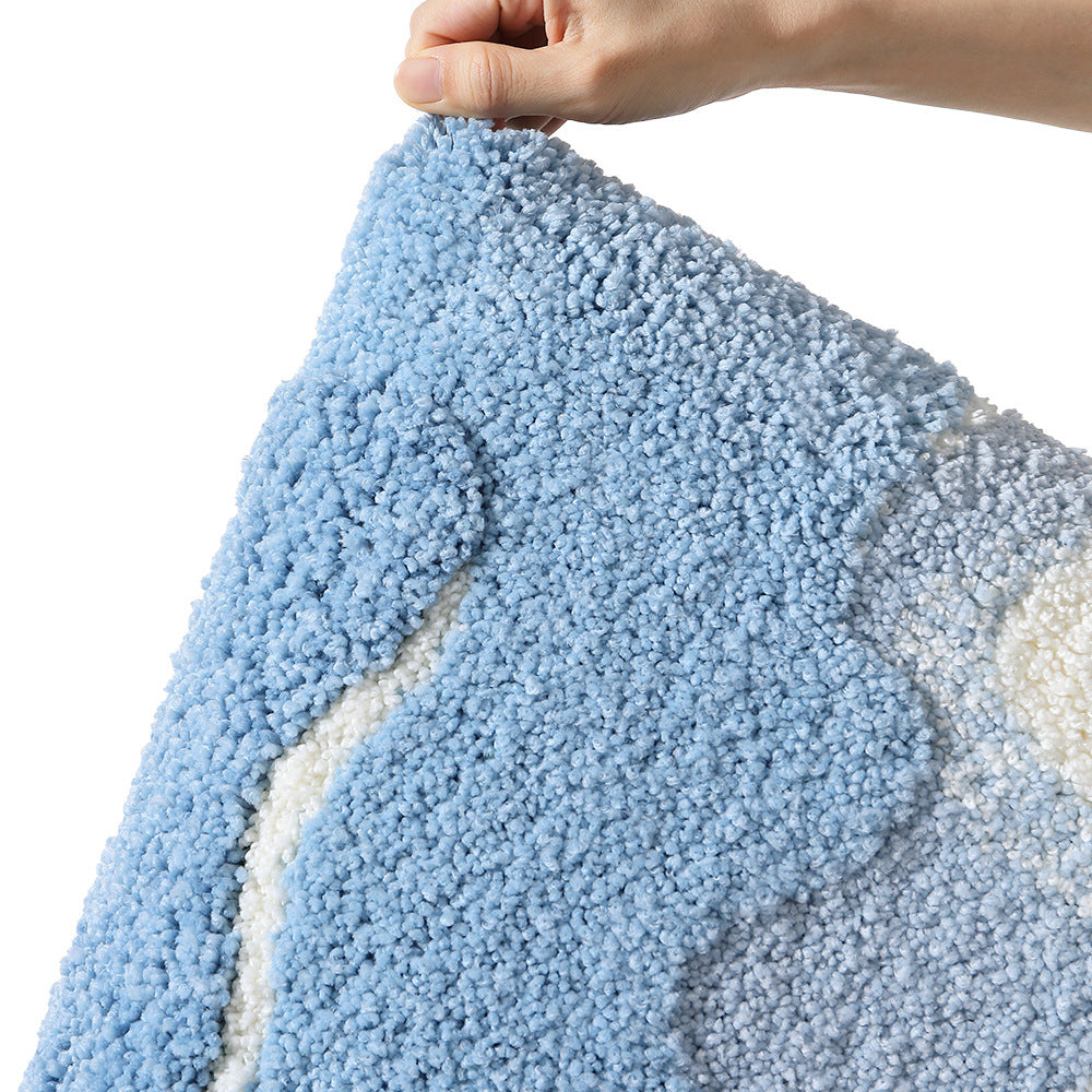 Underside of the floral bath mat showing the geometric patterned non slip backing