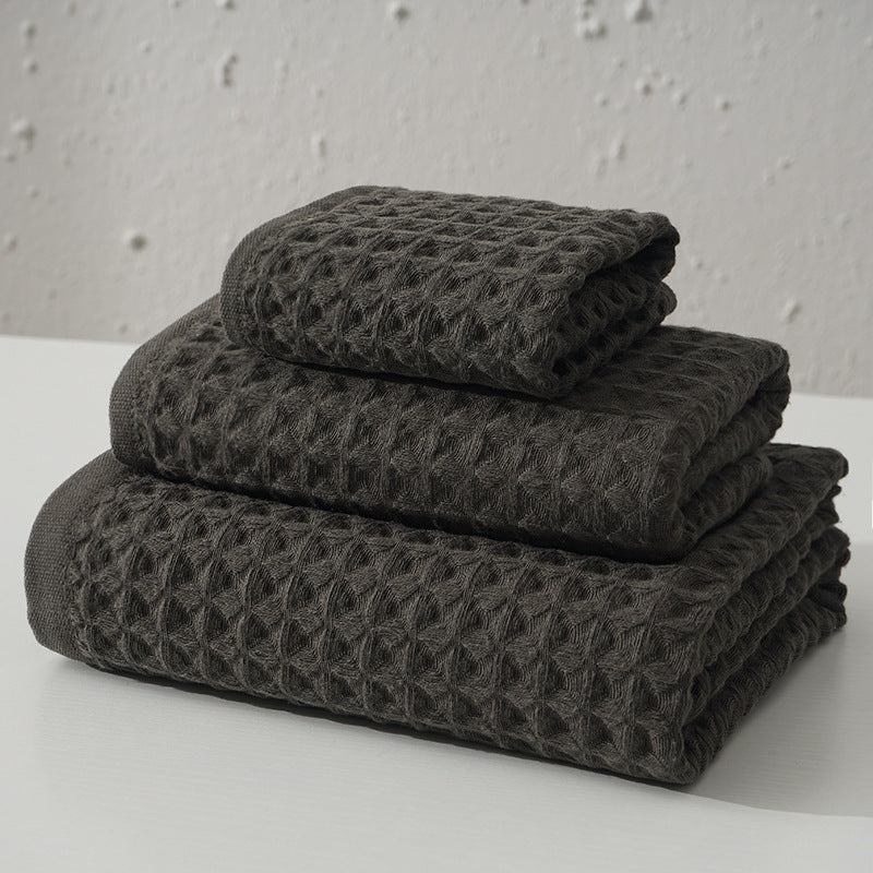 Three piece dark brown waffle weave cotton towel set with bath towel, hand towel and washcloth