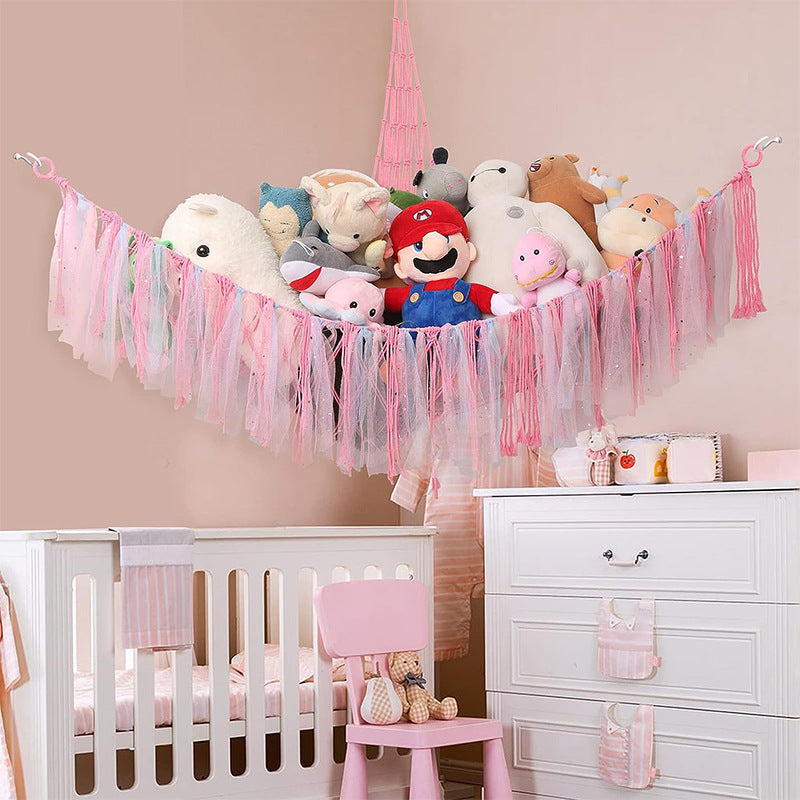 Corner plush toy storage hammock with pink ribbon accent