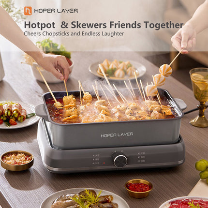 Cool touch side handles on the grey electric hot pot
