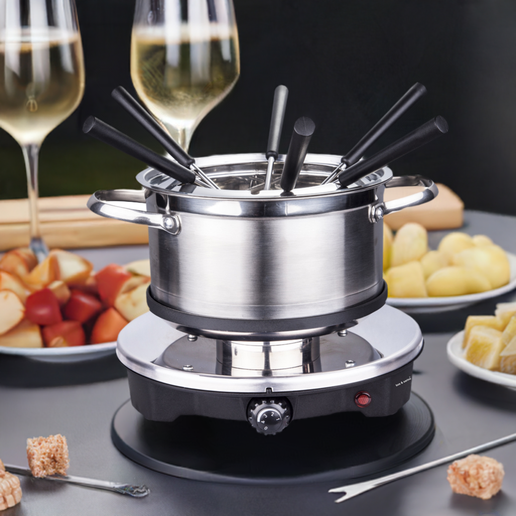 Fondue set components laid out including pot, covers and forks