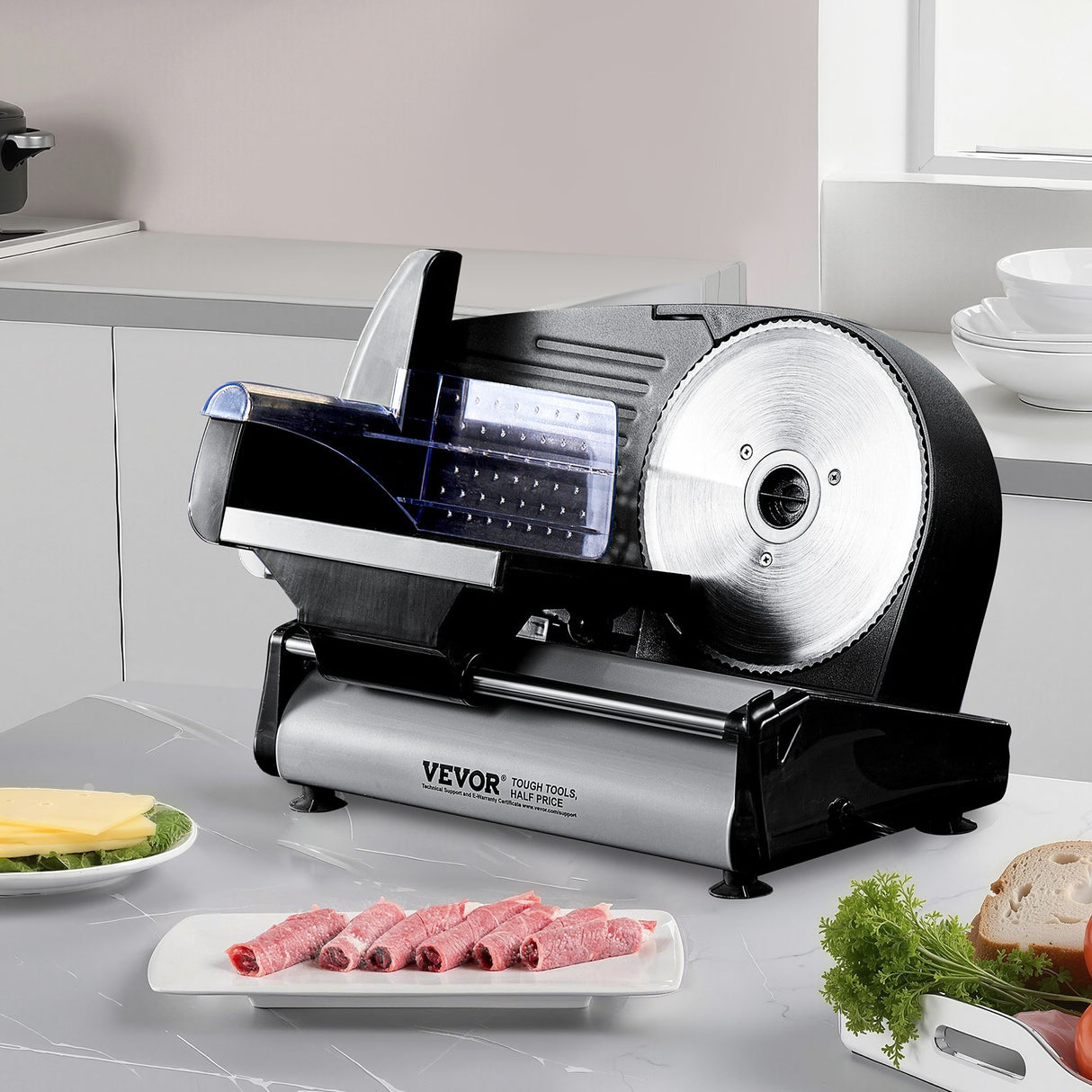 Electric slicer cutting even slices of ham