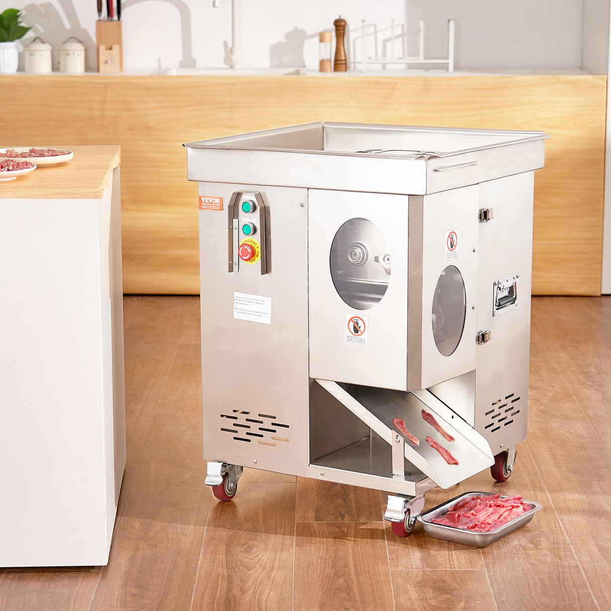 Meat slicer in use on a commercial kitchen bench