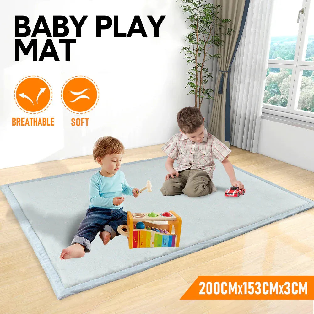 Baby crawling on soft grey memory foam play mat