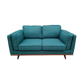 Marbella teal fabric sofa in a modern living room