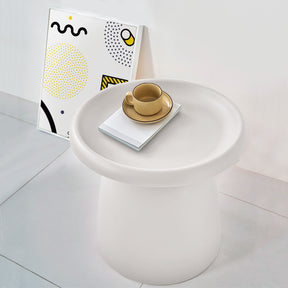 Millgrove white plastic coffee table in a modern living room