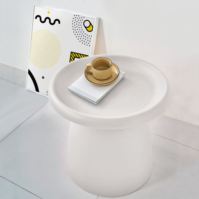 Millgrove white plastic coffee table in a modern living room