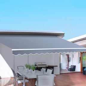 Dubrovnik manual folding arm awning pearl grey 4.0m x 2.5m patio shade extended over outdoor setting