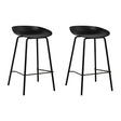 Carrum black metal bar stool with moulded seat in a minimalist kitchen