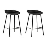 Carrum black metal bar stool with moulded seat in a minimalist kitchen