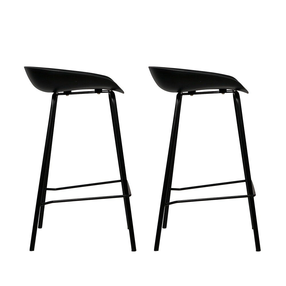 Carrum black metal bar stool with moulded seat in a minimalist kitchen
