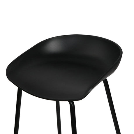 Carrum black metal bar stool with moulded seat in a minimalist kitchen