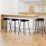 Carrum black metal bar stool with moulded seat in a minimalist kitchen