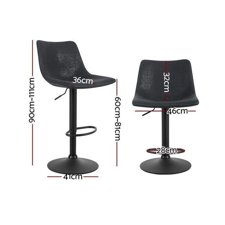 Korumburra vintage swivel bar stool black beside a kitchen island