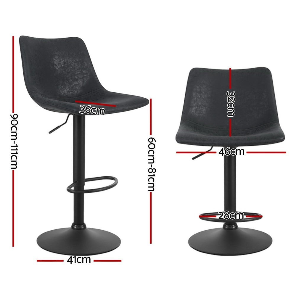 Korumburra vintage swivel bar stool black beside a kitchen island