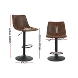 Korumburra vintage swivel bar stool brown beside a kitchen island