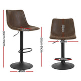 Korumburra vintage swivel bar stool brown beside a kitchen island