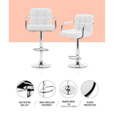Four Artiss leather armrest bar stools at long kitchen island — Allure Home Collections
