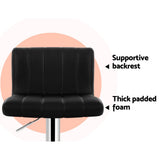 Two Artiss Como black gas lift bar stools at kitchen counter — Allure Home Collections