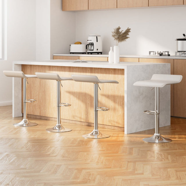 Lang Lang white gas lift swivel bar stool with steel base in a modern kitchen