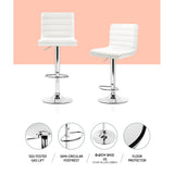 Set of 4 Artiss white gas lift bar stools at kitchen island — Allure Home Collections
