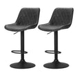 Tyabb black PU leather vintage swivel bar stool 2pcs set with steel pedestal at a home bar
