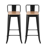 Cannons Creek black stackable industrial bar stool with pine seat in a kitchen