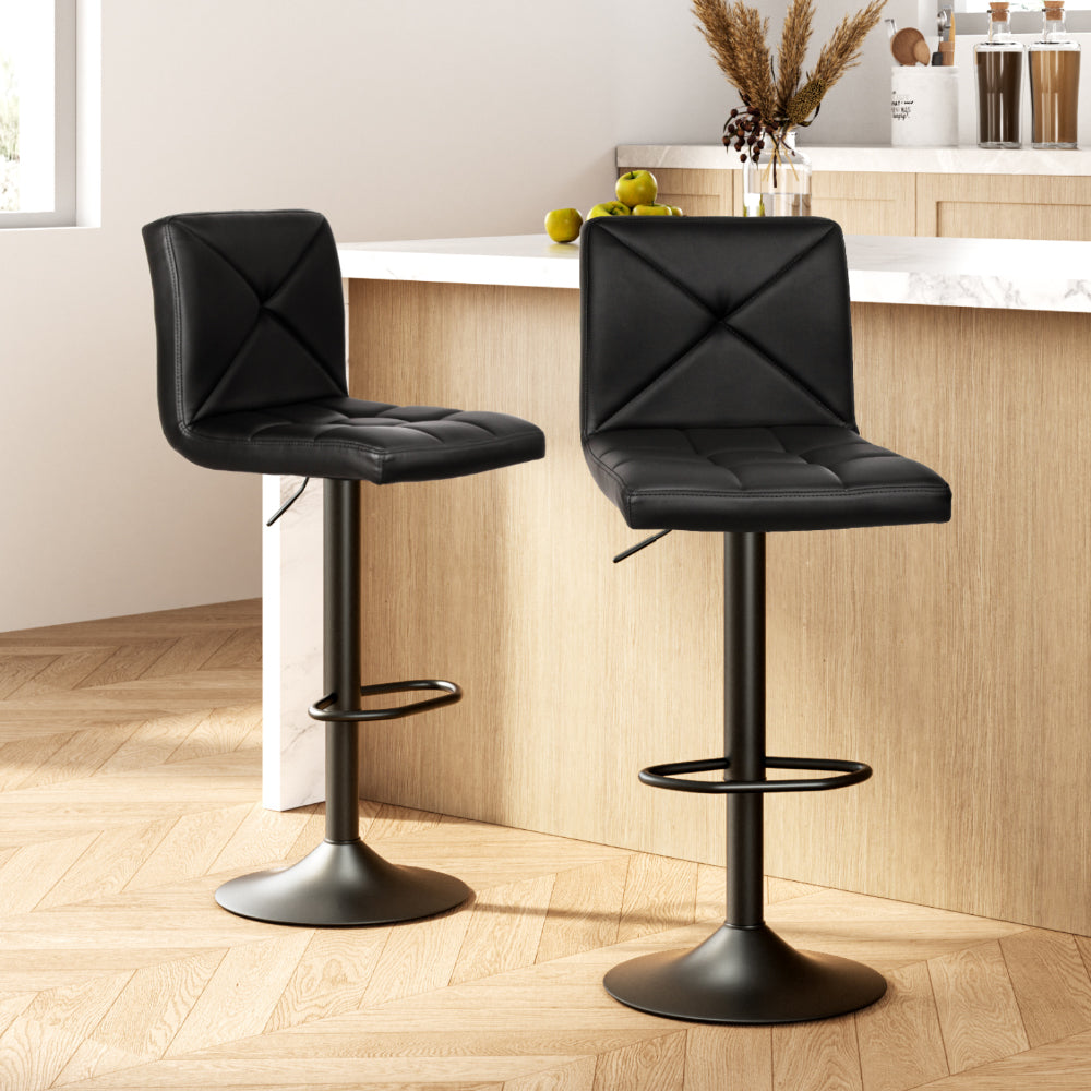 Pair of Artiss black gas lift bar stools in contemporary dining setting — Allure Home Collections
