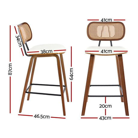 Warneet beige rattan bar stool with walnut frame at a kitchen counter
