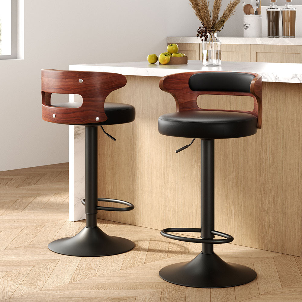 Seaford North black gas lift bar stool with padded mid back seat at a kitchen counter