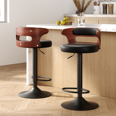 Seaford North black gas lift bar stool with padded mid back seat at a kitchen counter
