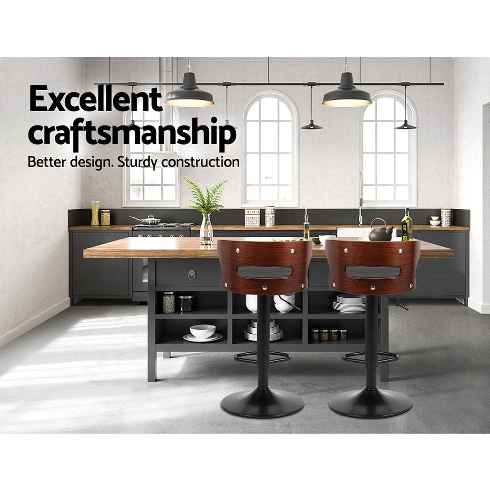 Two Artiss Grandeur faux leather bar stools at kitchen counter — Allure Home Collections