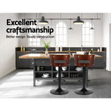 Two Artiss Grandeur faux leather bar stools at kitchen counter — Allure Home Collections