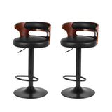 Seaford North black gas lift bar stool with padded mid back seat at a kitchen counter