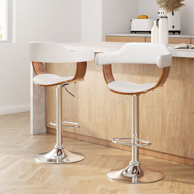 Sorrento white faux leather swivel bar stool with gas lift in a modern kitchen