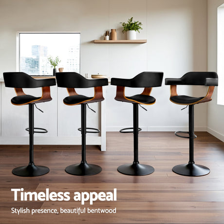 Four Artiss all black gas lift armrest bar stools in kitchen — Allure Home Collections