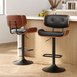 Blind Bight black gas lift swivel bar stool with chrome base in a modern kitchen