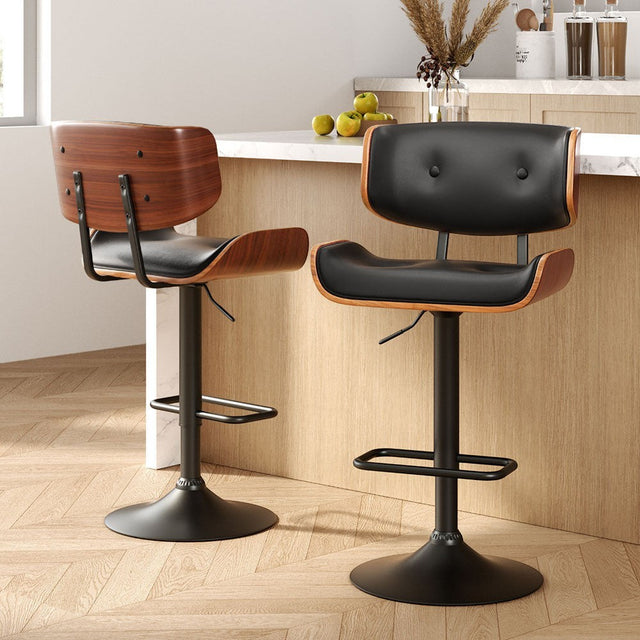 Blind Bight black gas lift swivel bar stool with chrome base in a modern kitchen