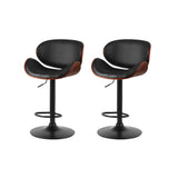 Carrum Downs black gas lift bar stool with padded leather seat at a kitchen counter
