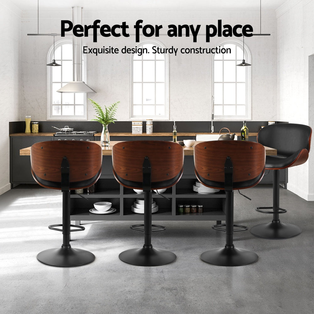 Four Artiss Joyce black bar stools in contemporary kitchen — Allure Home Collections