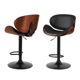 Carrum Downs black gas lift bar stool with padded leather seat at a kitchen counter