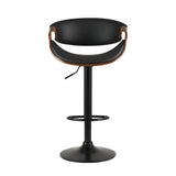 Tenby Point black gas lift swivel bar stool with curved backrest in a modern kitchen