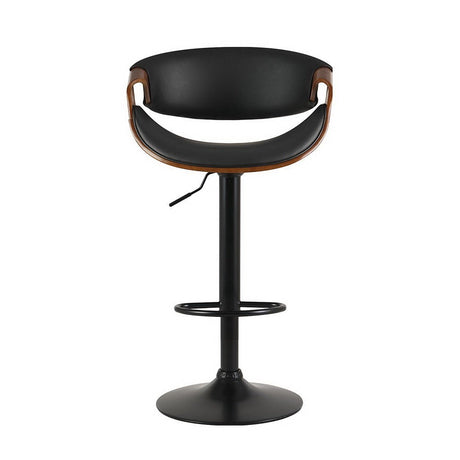 Tenby Point black gas lift swivel bar stool with curved backrest in a modern kitchen