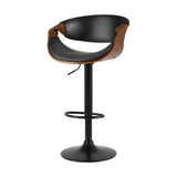 Tenby Point black gas lift swivel bar stool with curved backrest in a modern kitchen